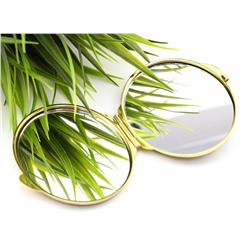 Складное зеркало с накладкой из серафинита овальное золотистое.