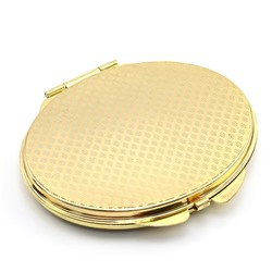 Складное зеркало с накладкой из серафинита овальное золотистое.