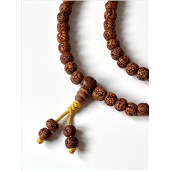 Чётки-Мала РУДРАКША ШЛИФОВАННАЯ, на Желтом шнуре (бусины по 6-8 мм., длина 42-44 см.), 1 шт.